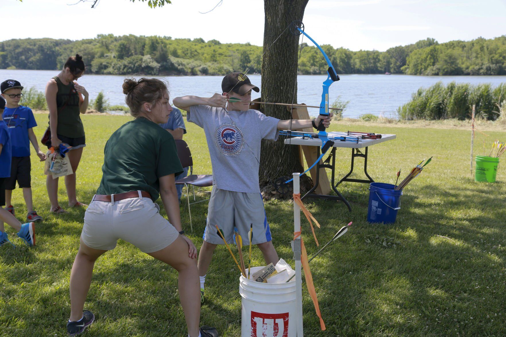Lena Caisley watches as Luke Piper takes aim